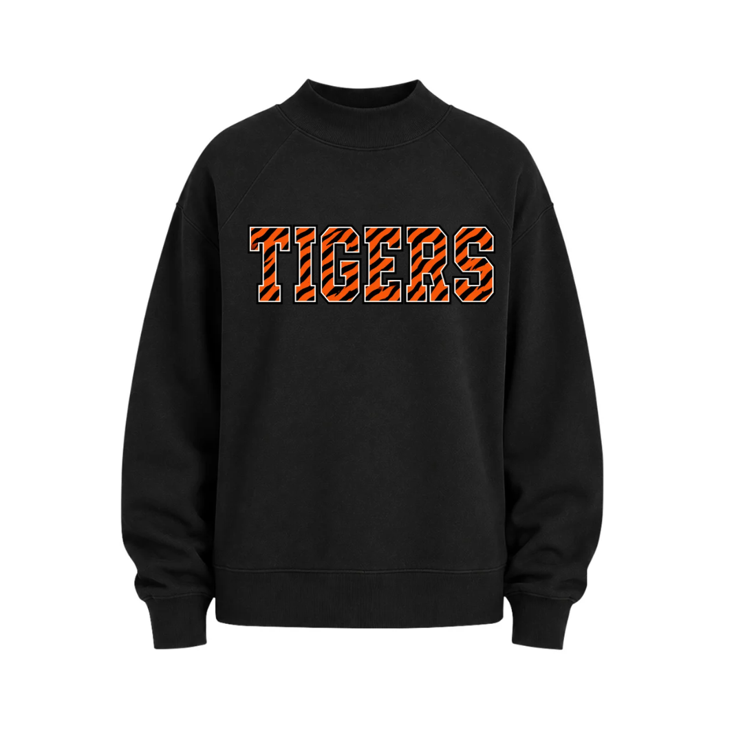A black crewneck sweatshirt featuring the word 'TIGERS' printed across the chest in orange block letters filled with a tiger-stripe pattern, set against a plain white background.