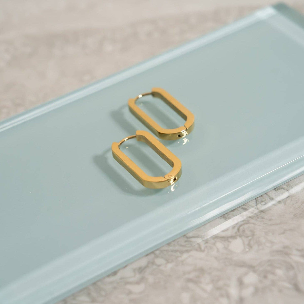 18K Gold PVD Stainless Stainless Steel Oval Huggie Earrings-Lemons and Limes Boutique