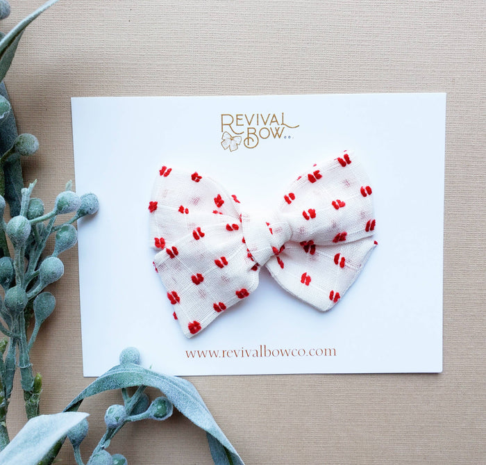 Christmas Bow on Clip in Red Dot--Lemons and Limes Boutique