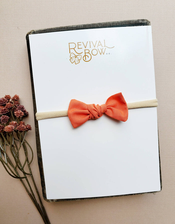 Newborn Knot Bow on Headband in Pumpkin Orange-Lemons and Limes Boutique